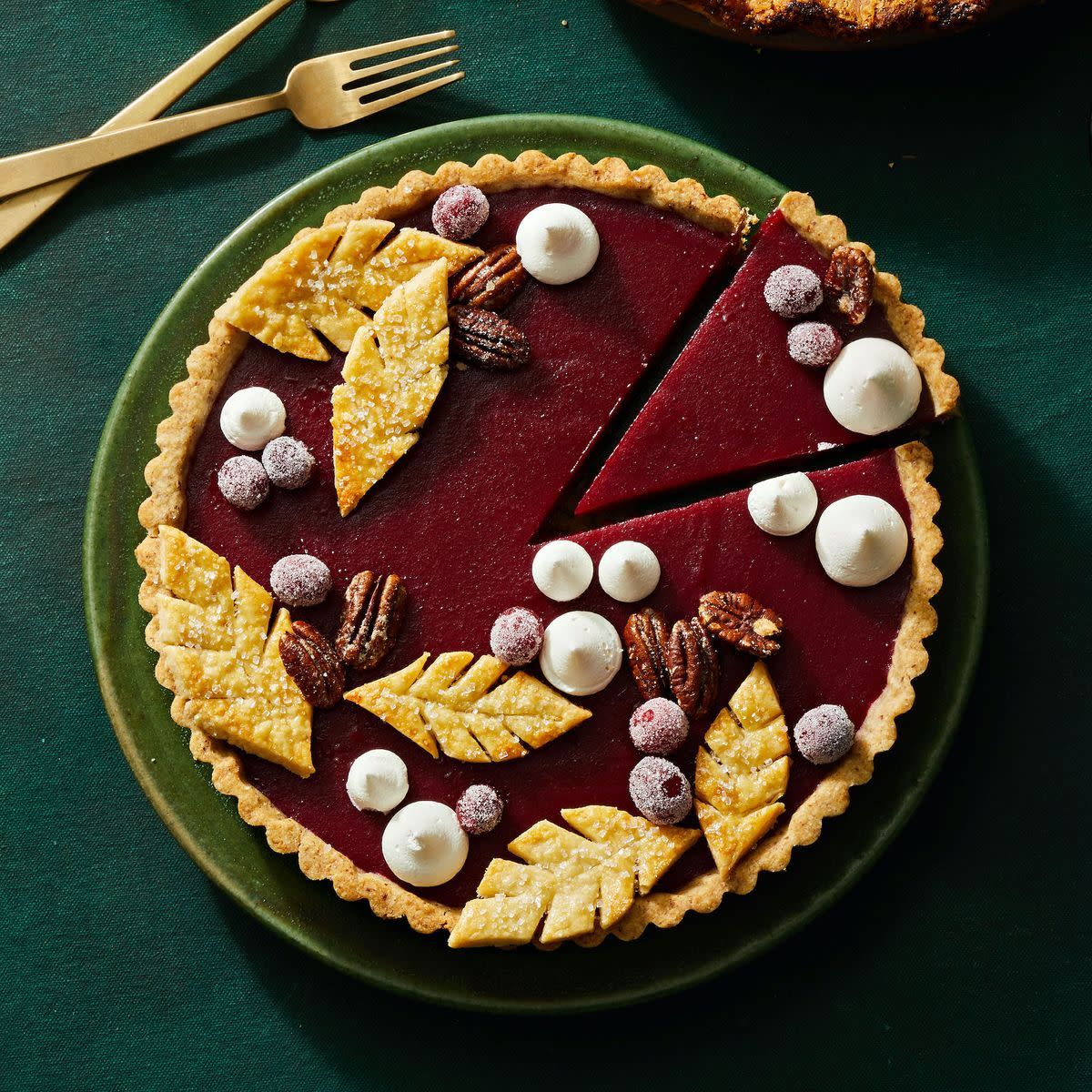 cranberry curd tart with decorative toppings