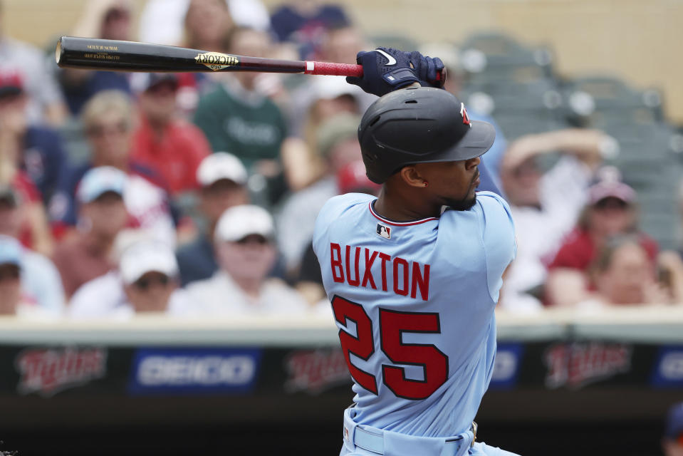 Minnesota Twins' Byron Buxton follows through on a swing during the first inning of a baseball game against the Tampa Bay Rays, Sunday, June 12, 2022, in Minneapolis. (AP Photo/Stacy Bengs)