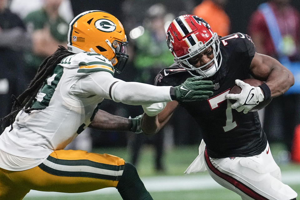 Atlanta Falcons running back Bijan Robinson (7) runs against Green Bay Packers running back AJ Dillon (28) during the second half of an NFL football game, Sunday, Sept. 17, 2023, in Atlanta. The Atlanta Falcons won 25-24. (AP Photo/John Bazemore)