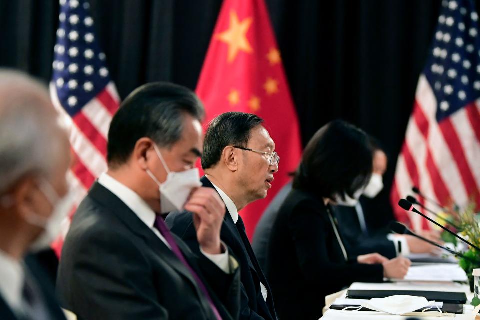 TOPSHOT - The Chinese delegation led by Yang Jiechi (C), director of the Central Foreign Affairs Commission Office and Wang Yi (2nd L), China's Foreign Minister, speak with their US counterparts at the opening session of US-China talks at the Captain Cook Hotel in Anchorage, Alaska on March 18, 2021. - China's actions 