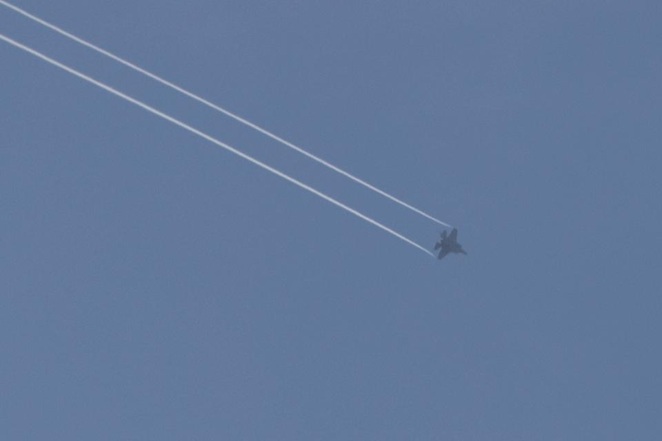 A photo taken from the southern Israeli city of Sderot shows an F-35I over the northern Gaza Strip, on October 29, 2023, amid ongoing battles between Israel and the Palestinian Hamas movement. <em>Photo by JACK GUEZ/AFP via Getty Images</em>