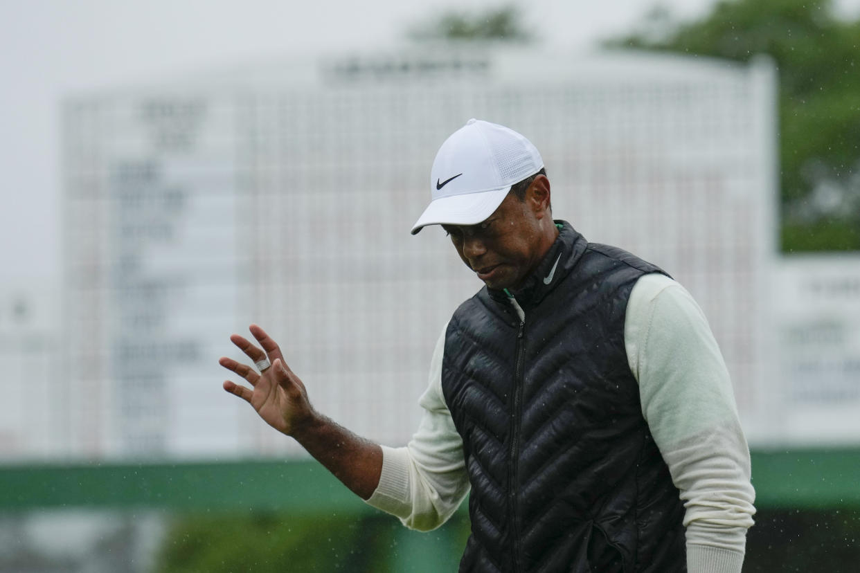 Tiger Woods waves after his weather delayed second round of the Masters at Augusta National Golf Club on Saturday, April 8, 2023, in Augusta, Ga. (AP Photo/Charlie Riedel)