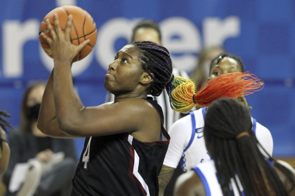 South Carolina's Aliyah Boston, left, shoots near Kentucky's Rhyne Howard during the second half of an NCAA college basketball game in Lexington, Ky., Sunday, Jan. 10, 2021. (AP Photo/James Crisp)