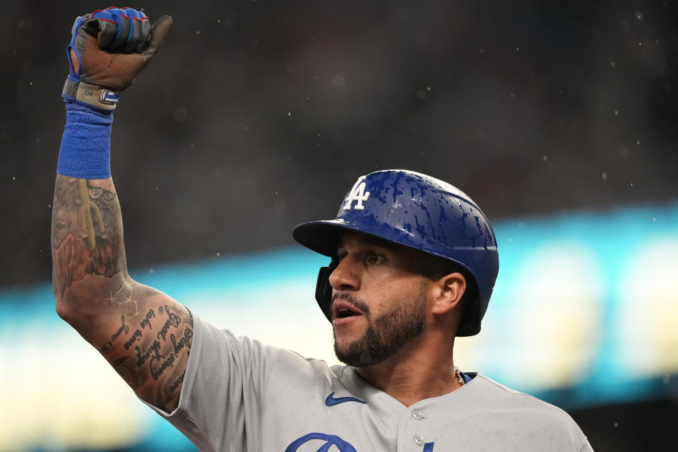 Los Angeles Dodgers' David Peralta reacts after hitting an RBI-triple in the fourth inning of a baseball game against the Atlanta Braves, Monday, May 22, 2023, in Atlanta. (AP Photo/John Bazemore)