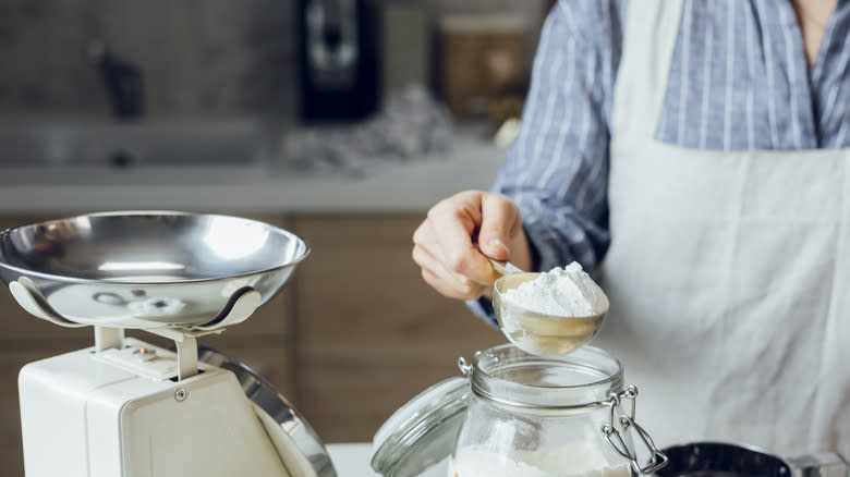 Woman measuring flour