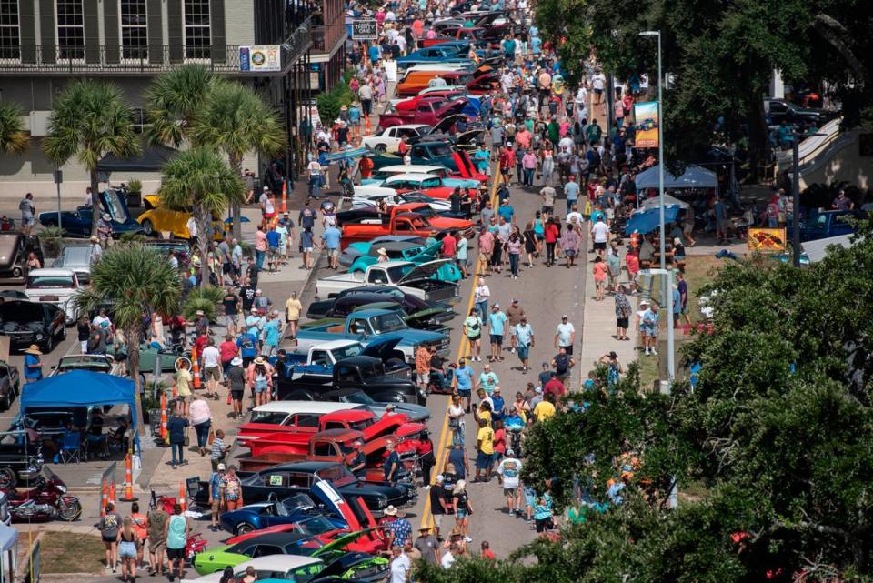 Spectators walk among classic cars in downtown Biloxi during the Biloxi Block Party, one of many Cruisin’ the Coast events, on Wednesday, Oct. 4, 2023. Nearly 10,000 vehicles are registered for 2023’s Cruising’ the Coast.