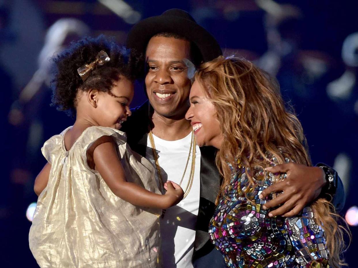 Jay Z and singer Beyonce with daughter Blue Ivy Carter onstage during the 2014 MTV Video Music Awards at The Forum on August 24, 2014 in Inglewood, California