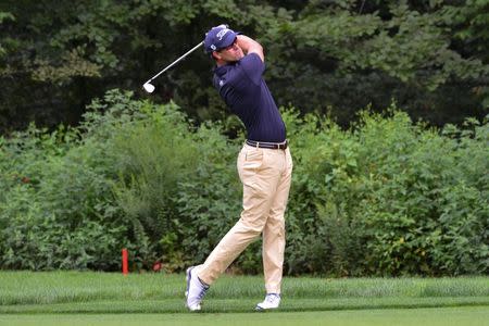 Aug 22, 2014; Paramus, NJ, USA; Adam Scott hits his second shot on the fourth hole during the second round of The Barclays golf tournament at Ridgewood Country Club. Tommy Gilligan-USA TODAY Sports