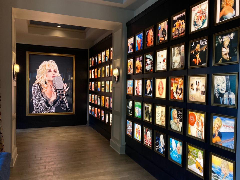 Dolly Parton's albums on display in a hallway at the Dollywood DreamMore Resort.