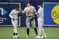 New York Yankees left fielder Miguel Andujar, left, center fielder Aaron Judge, center, and right fielder Joey Gallo, right, celebrate after defeating the Tampa Bay Rays during a baseball game Thursday, May 26, 2022, in St. Petersburg, Fla. (AP Photo/Chris O'Meara)