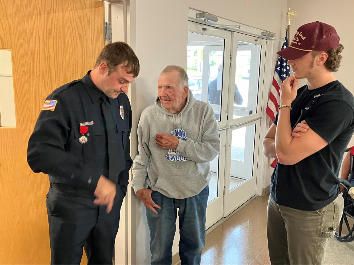 Tom Moyer, center, visits with the people who rescued him from a house fire on March 15. Bailey Dretzka, a Johnsville firefighter, left,  and Bryer Miller, right, were the heroes.