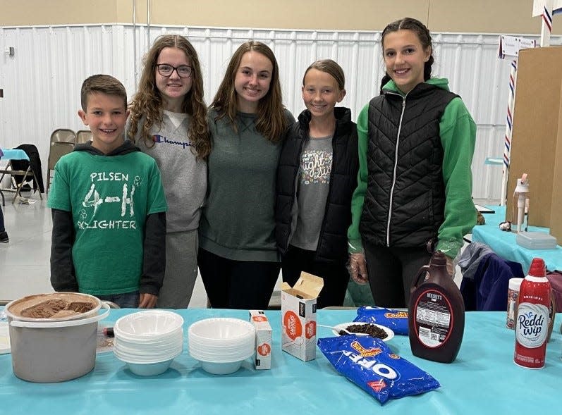 Members of the Pilsen Skylighters 4-H Club in Kewaunee County pose at an ice cream social they held last October. The club's ice cream skills extend further, as their suggestion for Cow Lick Ice Cream was named the Grand Prize winner in Cedar Crest Ice Cream's annual Flavor Creation Contest for 4-H clubs across Wisconsin. It will be served at ice cream shops across the Midwest in July.