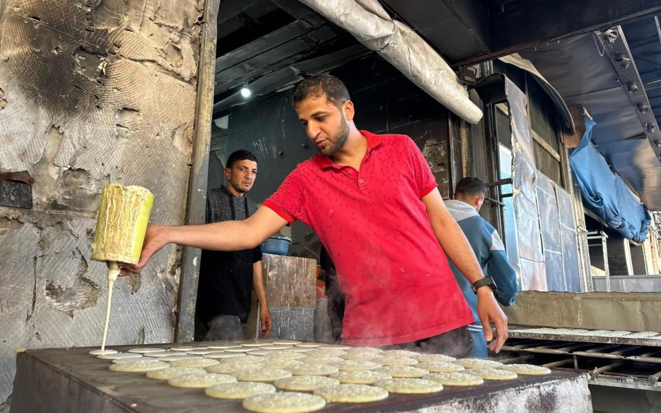 A 53-year old katayef master Abu Ashraf Akl, whose shop at the Nuseirat Refugee Camp was damaged in the Israeli attacks,