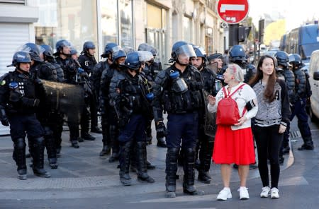 Protesters attend a demonstration on Act 45 (the 45th consecutive national protest on Saturday) of the yellow vests movement in Paris