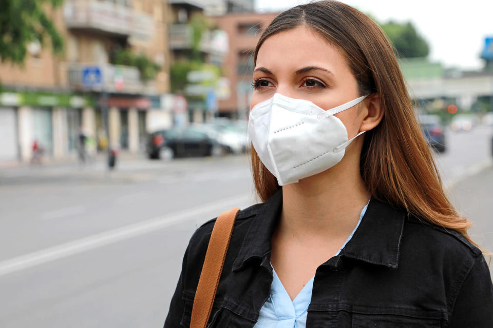 A woman wearing a KN95 face mask that protects against the coronavirus