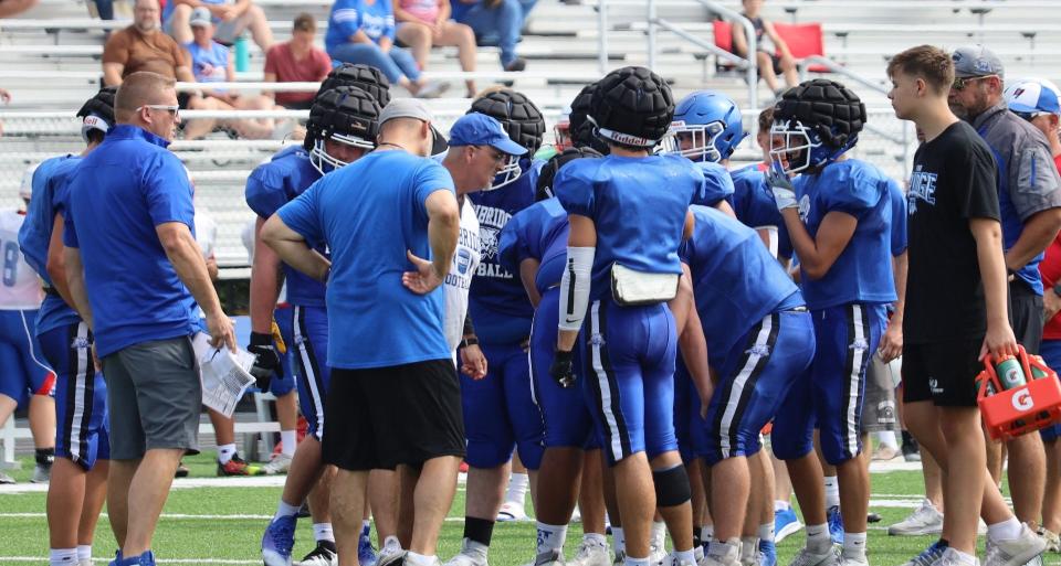 Cambridge assistant coach Kevin Gunn, center, attempts to fire up the Bobcats during last season's opening scrimmage action with Garaway at McFarland Stadium. After serving as an assistant coach on Ray Leek's staff for the past four seasons, Gunn was named head coach at Thursday night's Cambridge City Schools board of education meeting. This will be Gunn's second stint guiding the Bobcats' program having served in the role from 2012 to 2018.