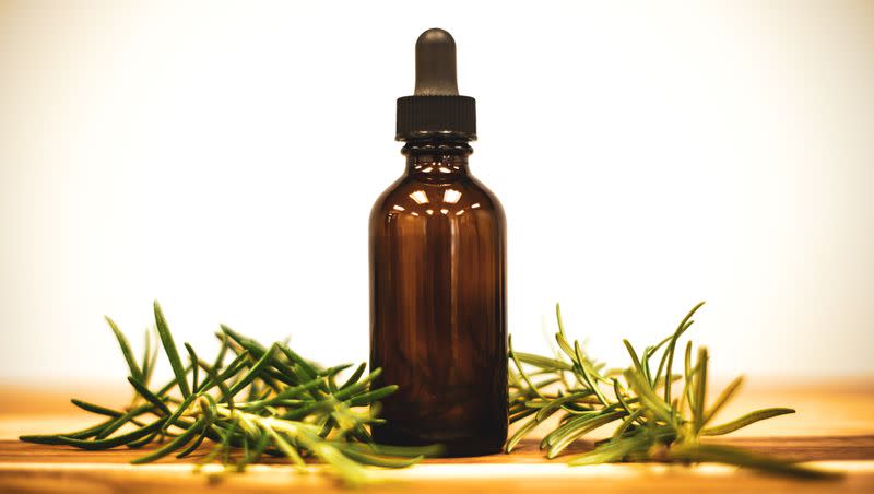 Rosemary oil and rosemary herb pictured. 