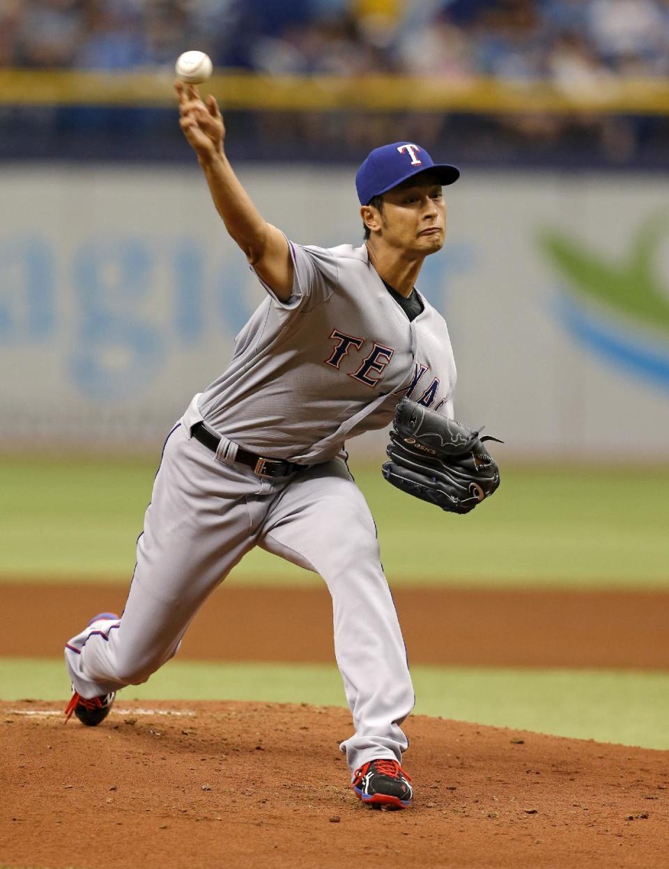 Texas Rangers starting pitcher Yu Darvish throws during the first inning of a baseball game against the Tampa Bay Rays, Sunday, April 6, 2014, in St. Petersburg, Fla. (AP Photo/Mike Carlson)