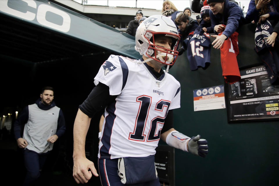 New England Patriots' Tom Brady runs onto the field before an NFL football game against the Philadelphia Eagles, Sunday, Nov. 17, 2019, in Philadelphia. (AP Photo/Matt Rourke)