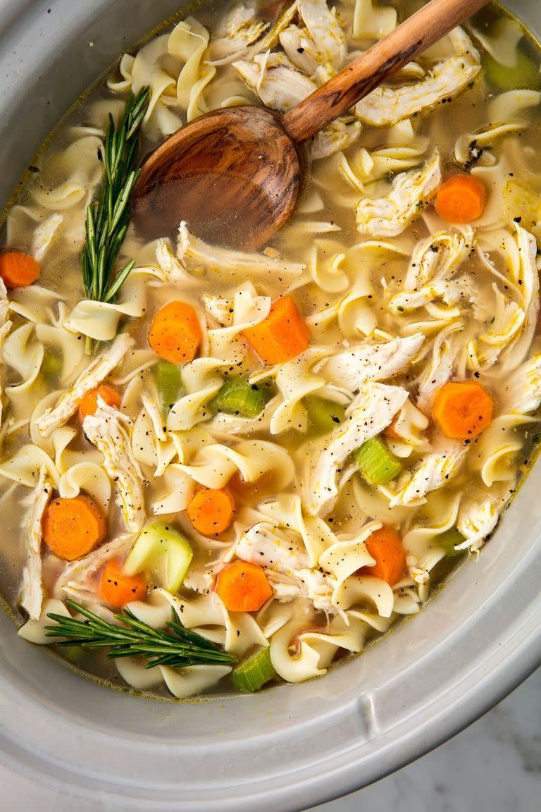 <p>Homemade chicken noodle soup is already easy to whip up, but tossing all of your ingredients in a slow cooker makes it even easier. </p><p>Get the <a href="https://www.delish.com/uk/cooking/recipes/a29124077/easy-crockpot-chicken-noodle-soup-recipe/" rel="nofollow noopener" target="_blank" data-ylk="slk:Slow Cooker Chicken Noodle Soup;elm:context_link;itc:0;sec:content-canvas" class="link ">Slow Cooker Chicken Noodle Soup</a> recipe.</p>