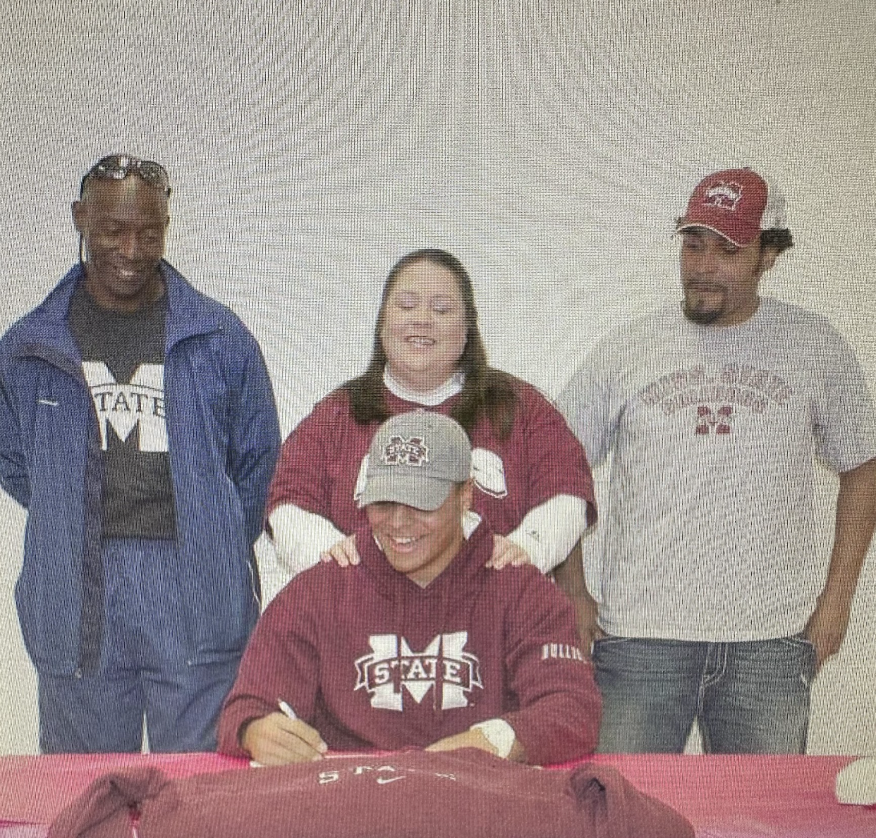 In her final months, Peggy Prescott (top center), was able to see her son earn Mississippi State's starting quarterback job. (Courtesy Valrie Gilbeaux)