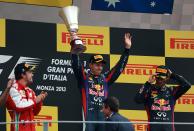 Red Bull Racing's Sebastian Vettel with the trophy on the podium after victory in the Italian Grand Prix and the Autodromo Nazionale Monza, Monza, Italy.