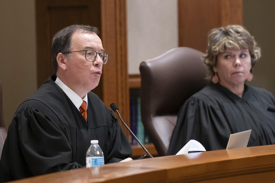 Associate Justice Gordon Moore questions Donald Trump's attorney Nicholas Nelson as he argued his case before the Court Thursday, Nov. 2, 2023 St. Paul, Minn. The Minnesota Supreme Court heard arguments to keep former President Trump off the ballot. (Glen Stubbe/Star Tribune via AP, Pool)