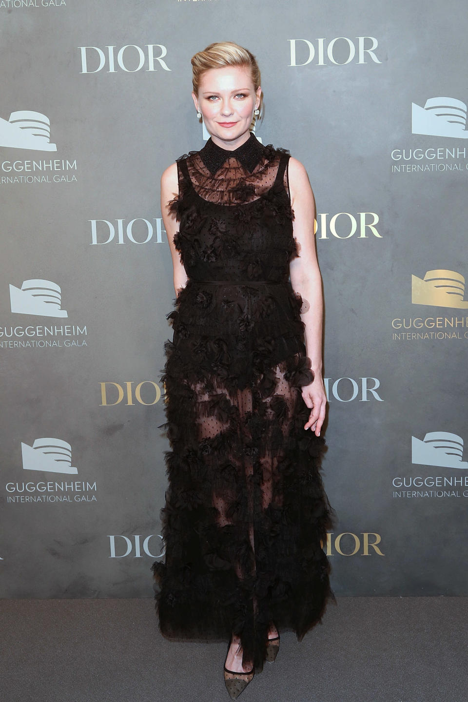 <p>The ‘Fargo’ star glammed up in a semi-sheer floor length Dior gown.<em> [Photo: Getty]</em> </p>