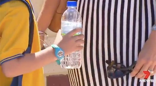 Students were handed out bottled water at schools found to have elevated lead levels. Source: 7 News