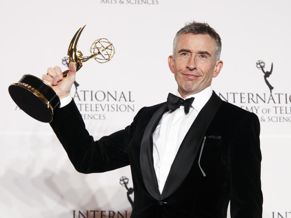 Actor Steve Coogan poses in the pressroom with the award for best comedy in “Alan Partridge’s Scissored Isle” at the at the New York Hilton on Monday, Nov. 20, 2017, in New York. (Photo by Andy Kropa/Invision/AP)