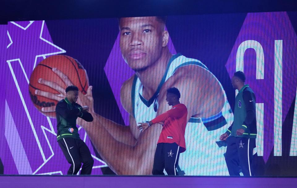 Giannis Antetokounmpo, left, is introduced along with brothers Alex and Thanasis during the 2022 NBA All-Star Skills Challenge.