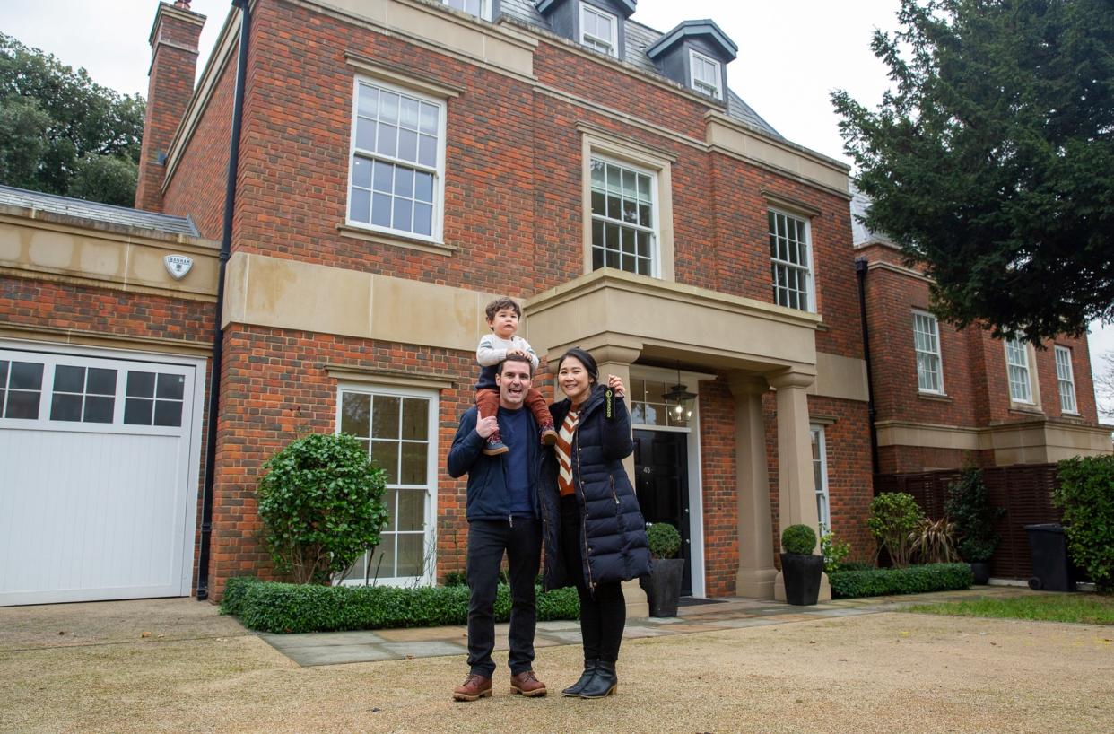 Heekyoung Jin with her partner Tom Hall and their son, Lukas