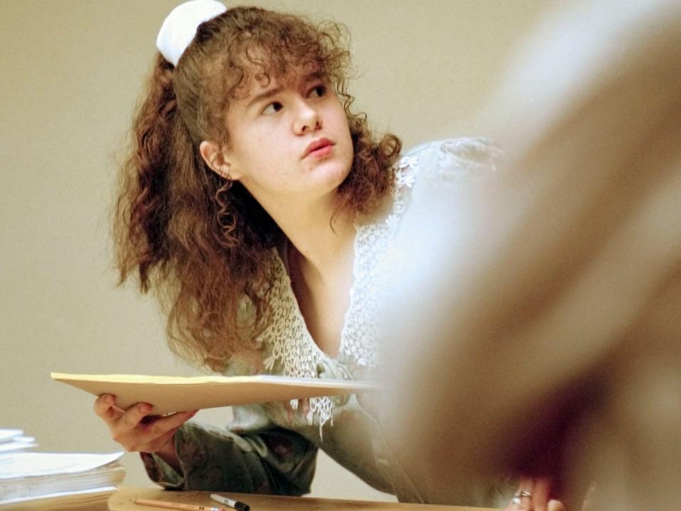 Christa Gail Pike turns to give her lawyer a note pad before being escorted from the courtroom for the lunch break Monday, March 18, 1996. 