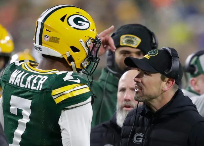 Green Bay Packers head coach Matt LaFleur approaches linebacker Quay Walker after he was ejected from the game against the Lions on Sunday after he pushed a Detroit trainer. It was the second time Walker was ejected from a game.