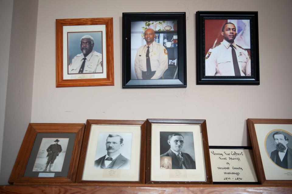 A wall of photos pays tribute to sheriffs in the Noxubee County Sheriff’s Department in Macon.