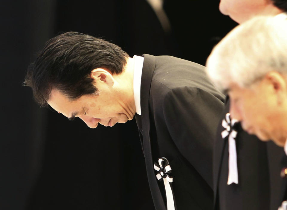 Former Japanese Prime Minister Naoto Kan bows to the altar during the national memorial service for the victims of the March 11, 2011, earthquake and tsunami in Tokyo Sunday, March 11, 2012. Through silence and prayers, people across Japan on Sunday remembered the massive disaster that struck the nation one year ago, killing just over 19,000 people and unleashing the world's worst nuclear crisis in a quarter century. (AP Photo/Japan POOL) JAPAN OUT