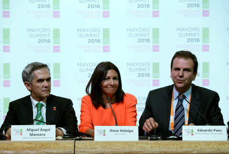 Rio de Janeiro mayor Eduardo Paes (R) speaks next to Mexico City's Mayor Miguel Angel Mancera (L) and Paris Mayor Anne Hidalgo during a news conference as they attend at the C40 Mayors Summit, in Mexico City, Mexico, November 30, 2016. REUTERS/Henry Romero