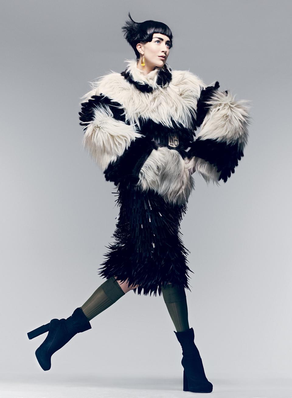 Raquel Zimmermann in Fendi’s black-mink-and-white-goat-fur coat, wood-buckle belt, and suede boots.