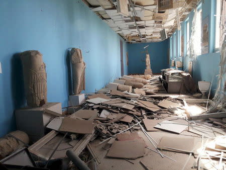 A view shows damaged artifacts inside the museum of the historic city of Palmyra, after forces loyal to Syria's President Bashar al-Assad recaptured the city, in Homs Governorate in this handout picture provided by SANA on March 27, 2016. REUTERS/SANA/Handout via Reuters