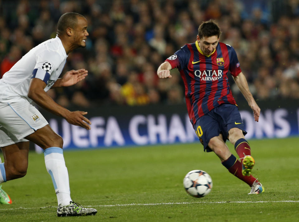 Barcelona's Lionel Messi, right shoots on goal during a Champions League, round of 16, second leg, soccer match between FC Barcelona and Manchester City at the Camp Nou Stadium in Barcelona, Spain, Wednesday March 12, 2014. (AP Photo/Emilio Morenatti)