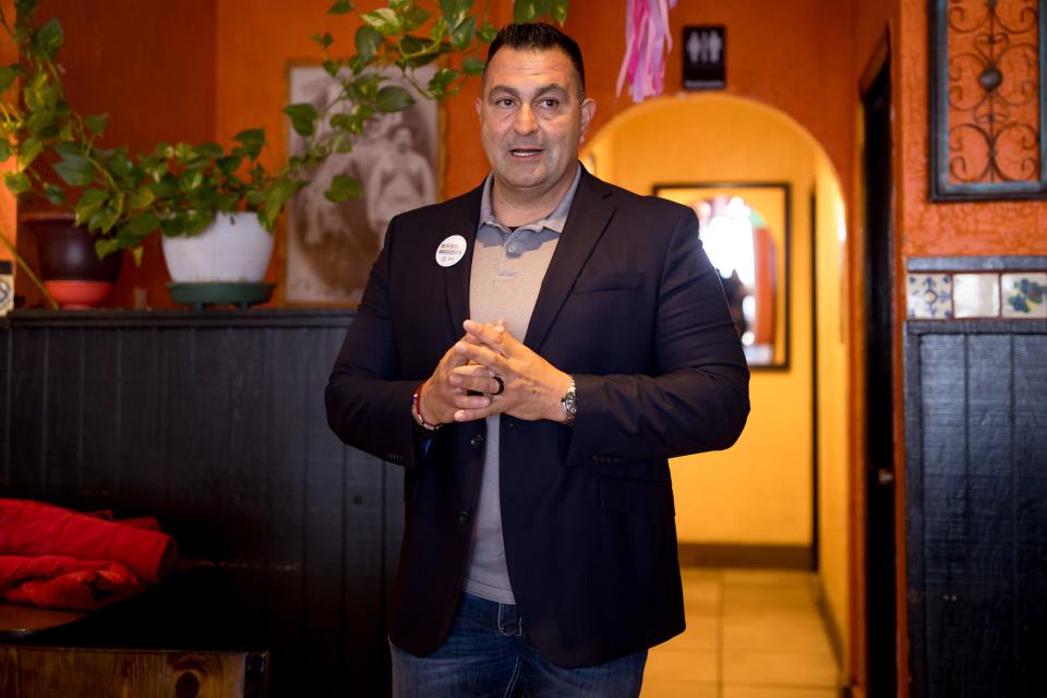 Robert "Bobby" Flores, candidate for El Paso County sheriff, talks to volunteers at El Crucero Mexican Grill, where they met for his "Socorro Day" campaign on Saturday, Feb. 17, in Socorro, Texas.