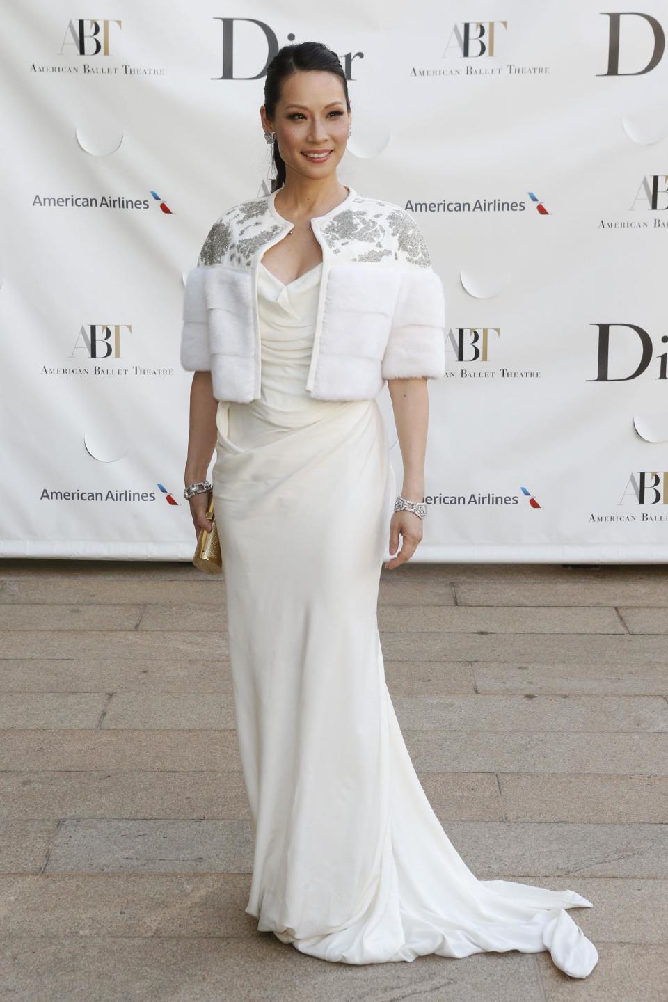 FILE - In this May 13, 2013 file photo, actress Lucy Liu arrives for the American Ballet Theatre Spring Gala at the Metropolitan Opera House, in New York. George Clooney, 52, Hollywood’s most determined bachelor famous for a litany of fleeting loves, including Liu, has taken himself off the romantic market and proposed to 36-year-old attorney, Amal Alamuddin. A spokesman for the Oscar-winning actor and producer did not respond to requests for comment Monday, April 28, 2014. (Photo by Jason DeCrow/Invision/AP, file)