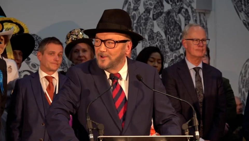 A smiling George Galloway takes aim at Labour leader Keir Starmer after being elected as Rochdale MP (PA)