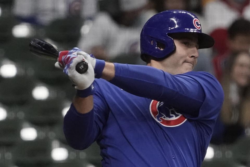 Chicago Cubs' Anthony Rizzo hits a single during the fourth inning of a baseball game against the Milwaukee Brewers Tuesday, April 13, 2021, in Milwaukee. (AP Photo/Morry Gash)