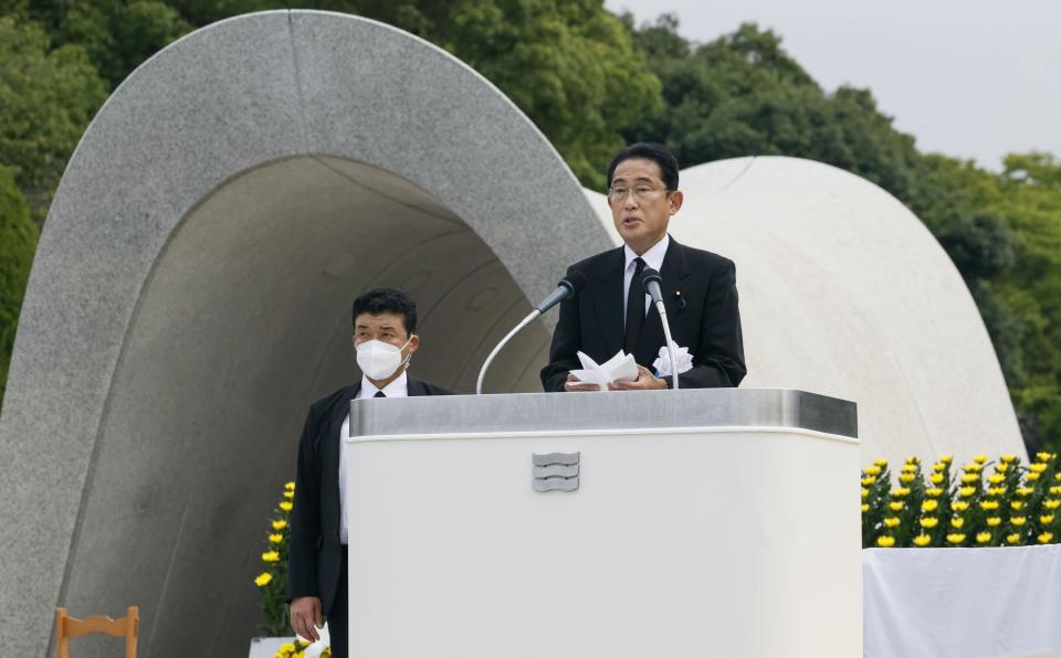 Japan's Prime Minister Fumio Kishida delivers a speech during the ceremony marking the 77th anniversary of the Aug. 6 atomic bombing in the city, at the Hiroshima Peace Memorial Park in Hiroshima, western Japan Saturday, Aug. 6, 2022. (Kenzaburo Fukuhara/Kyodo News via AP)