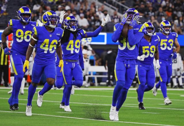 INGLEWOOD, CA - AUGUST 21, 2021: Los Angeles Rams safety J.R. Reed (36), right, reacts after he intercepted a pass thrown by Las Vegas Raiders quarterback Nathan Peterman (3) in the first half at SoFi Stadium on August 21, 2021 in Inglewood, California.(Gina Ferazzi / Los Angeles Times)
