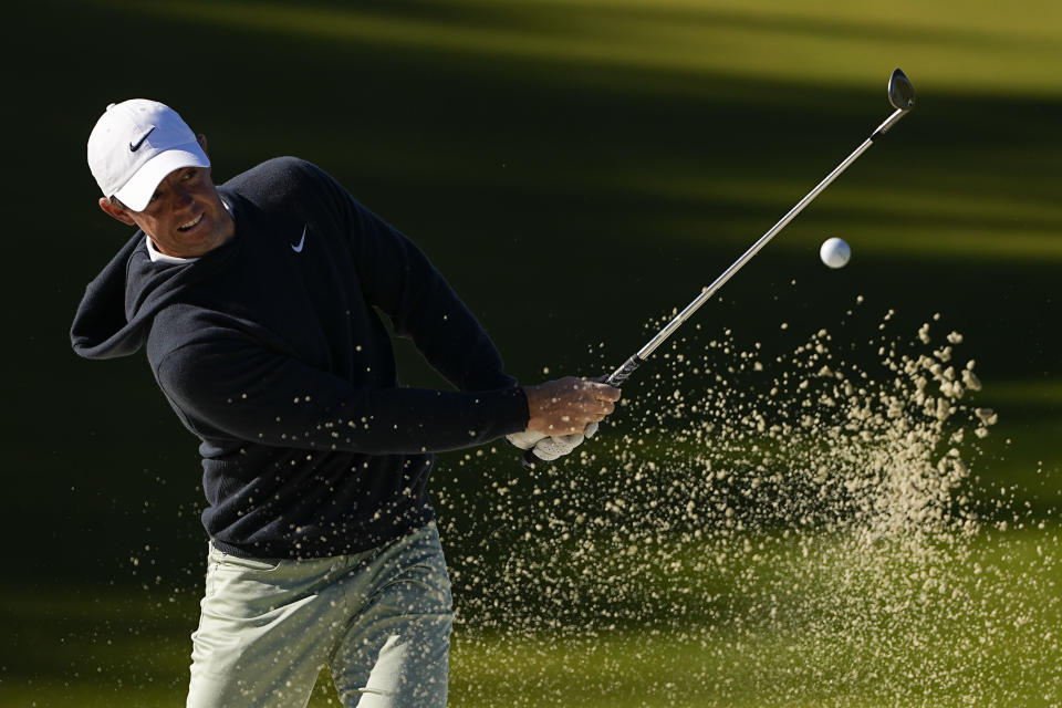 Rory McIlroy, of Northern Ireland, hits from the bunker on the 14th hole during first round of the Wells Fargo Championship golf tournament at the Quail Hollow Club on Thursday, May 4, 2023, in Charlotte, N.C. (AP Photo/Chris Carlson)