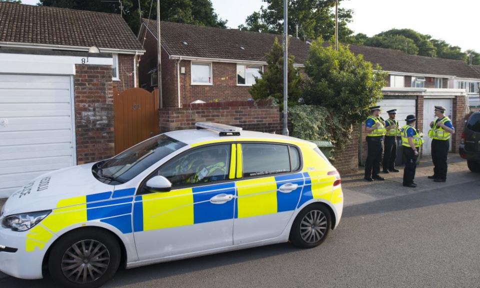 Police community support officers outside a house believed to be Darren Osborne’s home.