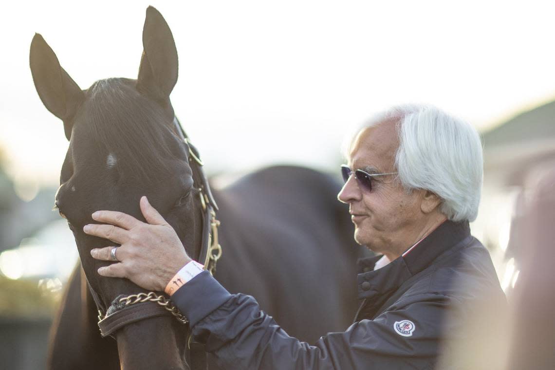 Trainer Bob Baffert stands with Medina Spirit outside his barn on the backside Churchill Downs on May 2, 2021, the day after the colt crossed the finish line first in the Kentucky Derby. Baffert was later suspended and stripped of the Kentucky Derby title after the horse tested positive for a banned substance. Ryan C. Hermens/rhermens@herald-leader.com