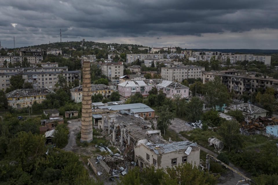 Damaged and destroyed homes are visible from Russian attacks on the recently liberated town of Izium, Ukraine, Wednesday, Sept. 14, 2022. Izium served as a hub for Russian soldiers for nearly seven months, during which they established torture sites throughout the city. (AP Photo/Evgeniy Maloletka)